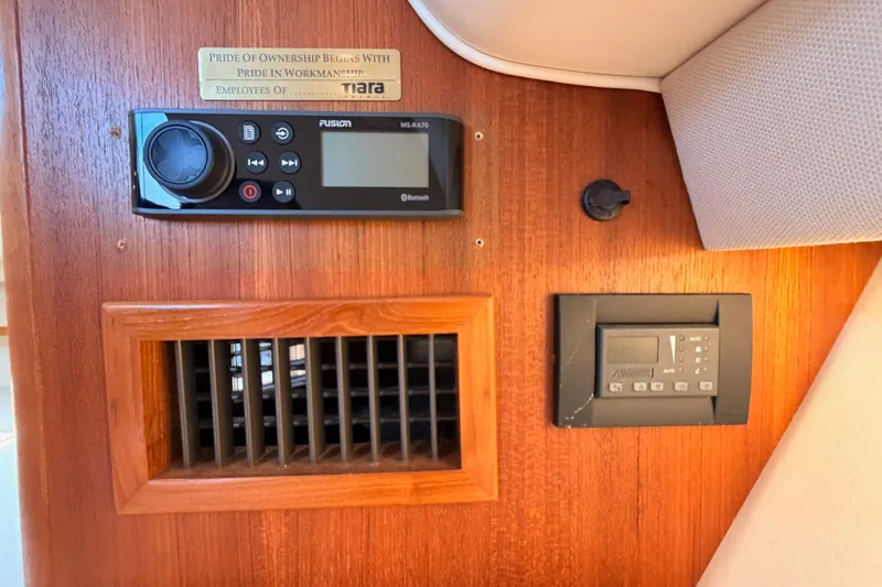 Slide: The Image of 2005 Tiara Yachts 2900 Open Classic interior with control panel and air vent. - 62
