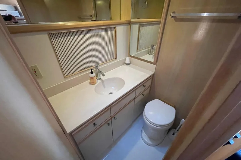 Slide: The Image of Bathroom interior of 1990 Tollycraft 34 Sport Sedan with sink and toilet. - 18