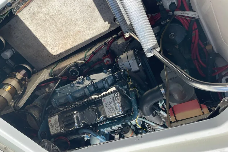 Slide: The Image of Engine compartment of a 1990 Tollycraft 34 Sport Sedan boat, showing detailed components. - 52