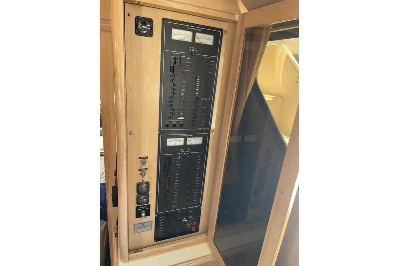 Slide: The Image of Electrical control panel on a 1990 Tollycraft 34 Sport Sedan boat. - 36