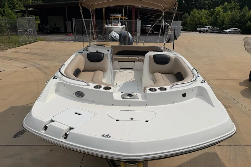 Slide: The Image of 2016 Hurricane SunDeck Sport 188 OB boat with beige seating, parked outdoors. - 4
