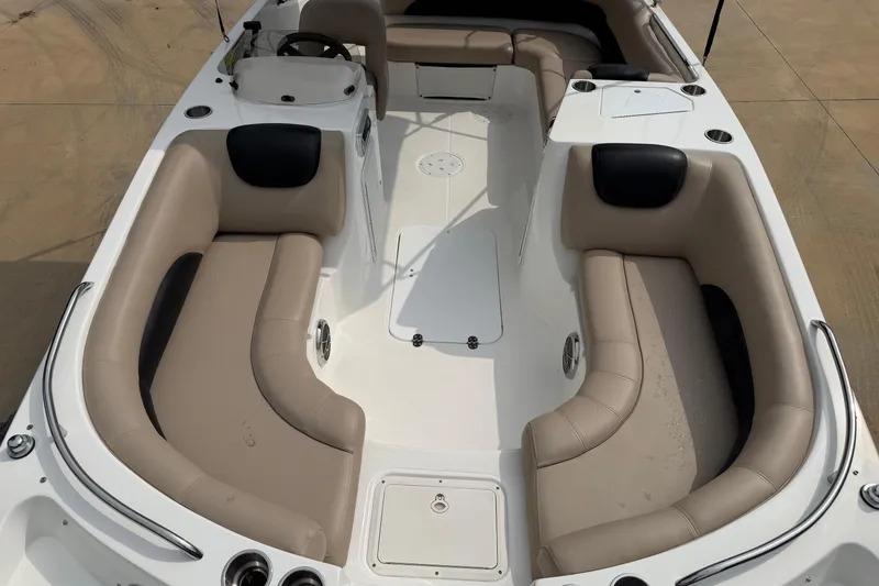 Slide: The Image of 2016 Hurricane SunDeck Sport 188 OB boat interior with beige seating and steering console. - 5