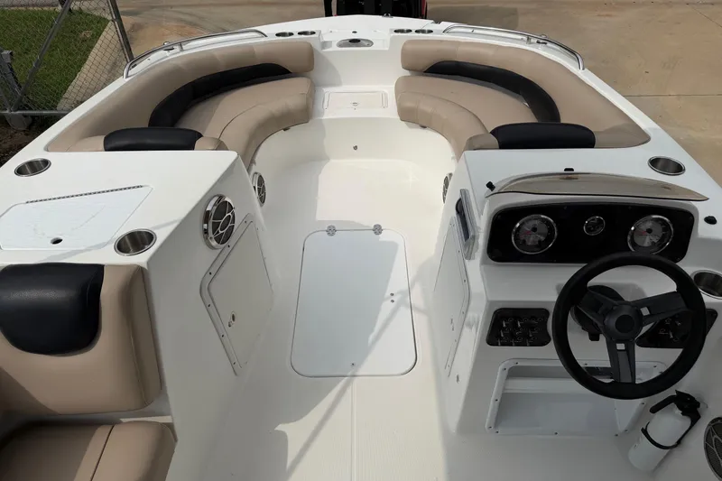 Slide: The Image of 2016 Hurricane SunDeck Sport 188 OB boat interior with seating and steering console. - 6