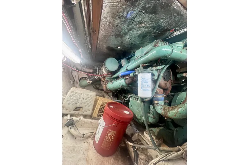 Slide: The Image of Engine room of a 1986 Bertram 46III Convertible with visible machinery and equipment. - 66