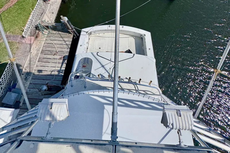 Slide: The Image of Overhead view of 1986 Bertram 46III Convertible yacht docked by the water. - 41