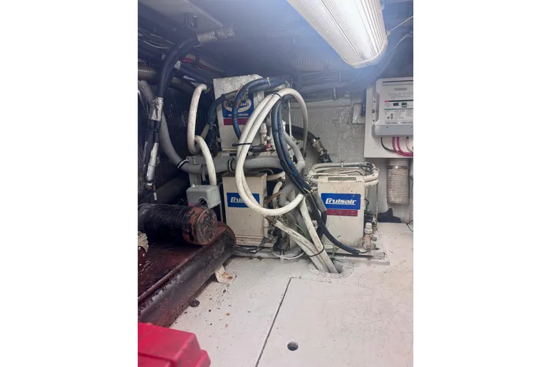 Slide: The Image of Engine room of a 1986 Bertram 46III Convertible with Cruisair equipment and wiring. - 62