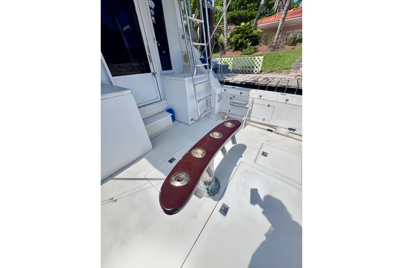 Slide: The Image of 1986 Bertram 46III Convertible yacht deck with fishing rod holders. - 12
