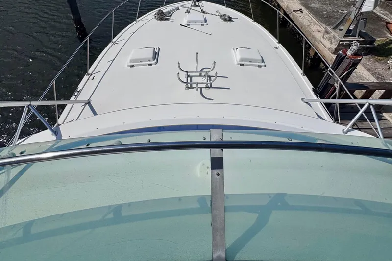 Slide: The Image of 1986 Bertram 46III Convertible yacht deck view at dockside. - 27