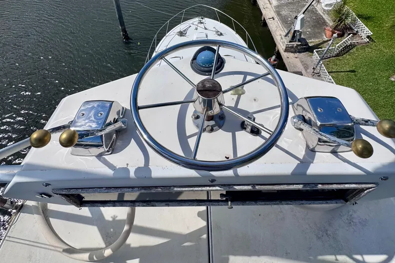 Slide: The Image of Helm of 1986 Bertram 46III Convertible yacht with steering wheel and controls. - 37