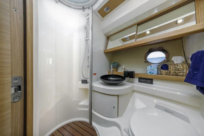 Slide: The Image of Luxurious bathroom in 2006 Azimut 43 yacht with modern fixtures and elegant design. - 26