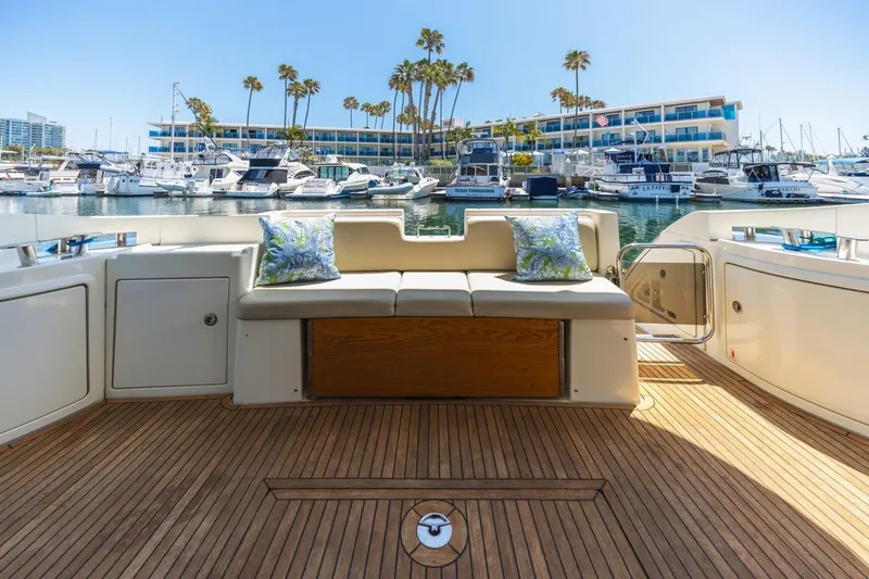 Slide: The Image of Luxurious 2006 Azimut 43 yacht deck with seating, docked at a marina. - 10