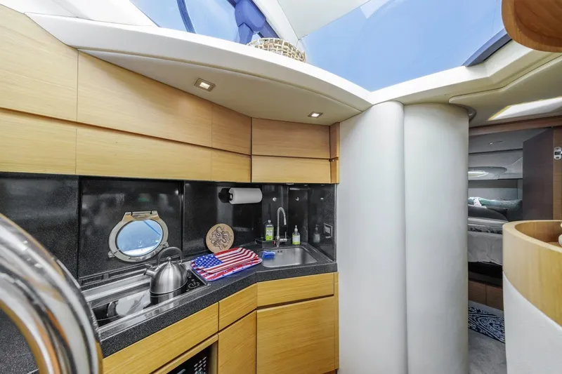Slide: The Image of Luxurious interior of a 2006 Azimut 43 yacht with modern kitchen amenities. - 30