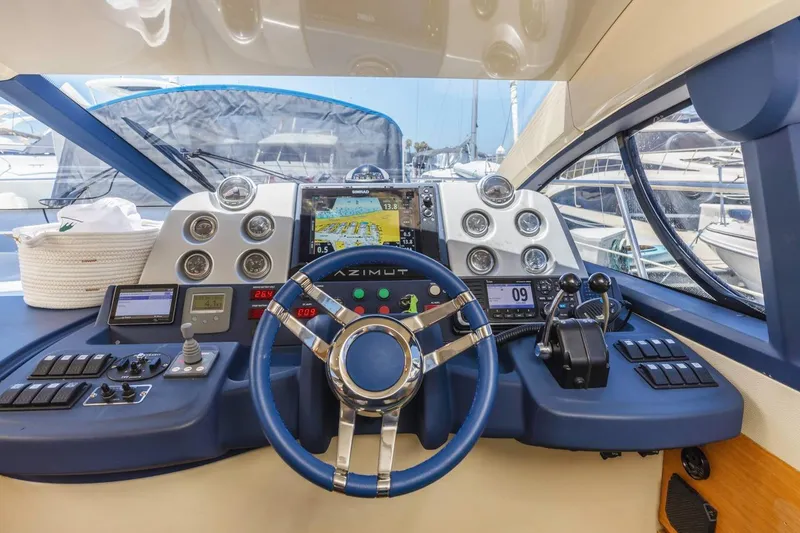 Slide: The Image of Cockpit of 2006 Azimut 43 yacht with navigation instruments and steering wheel. - 22