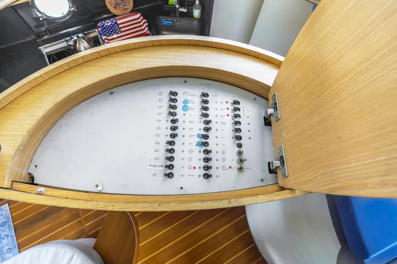 Slide: The Image of Electrical panel inside 2006 Azimut 43 yacht, featuring switches and controls. - 38
