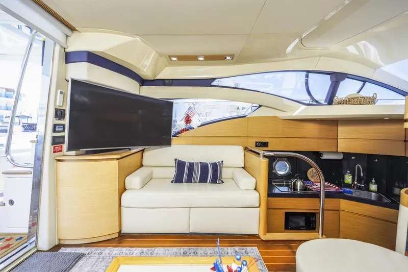 Slide: The Image of Luxurious interior of a 2006 Azimut 43 yacht with modern amenities and elegant design. - 20