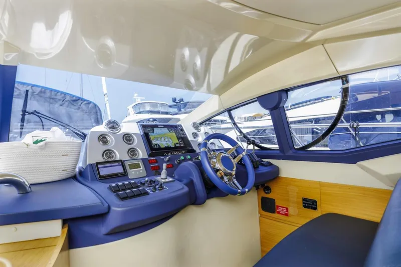 Slide: The Image of Interior cockpit of a 2006 Azimut 43 yacht with modern navigation equipment. - 21