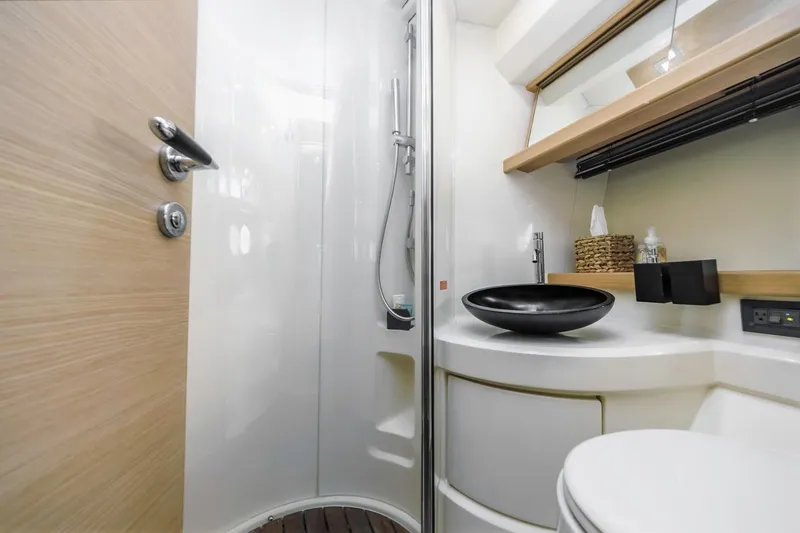 Slide: The Image of Luxurious bathroom interior of 2006 Azimut 43 yacht with modern fixtures and sleek design. - 36