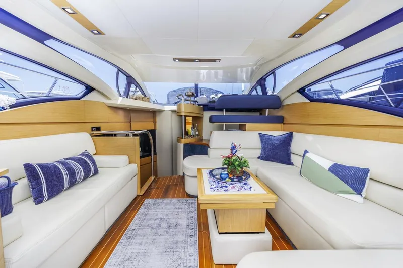 Slide: The Image of Luxurious interior of a 2006 Azimut 43 yacht with elegant seating and decor. - 18