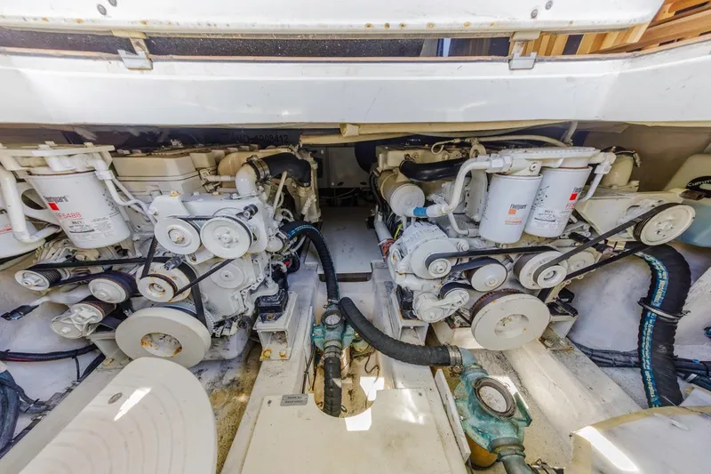 Slide: The Image of Engine room of a 2006 Azimut 43 yacht, showcasing dual engines and mechanical components. - 42