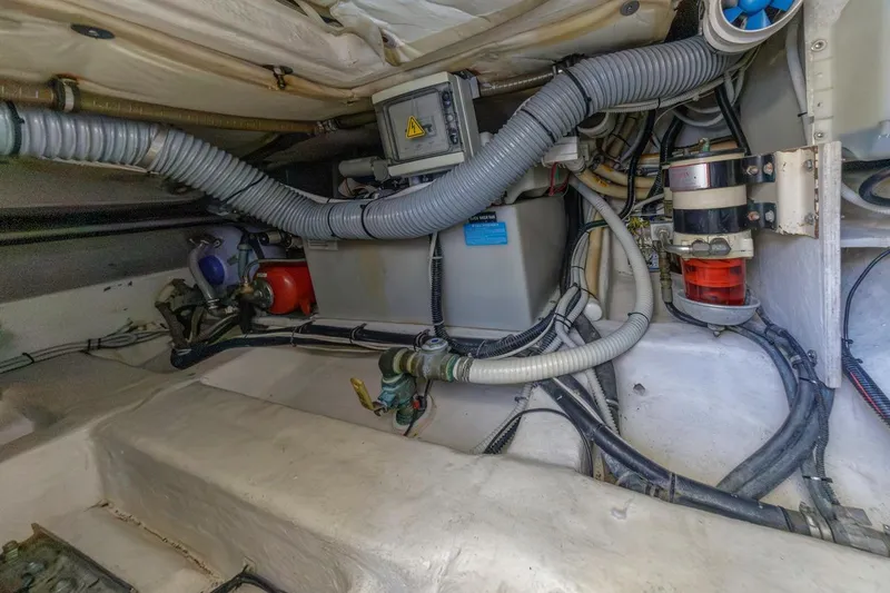Slide: The Image of Engine room of a 2006 Azimut 43 yacht, showcasing complex wiring and components. - 43