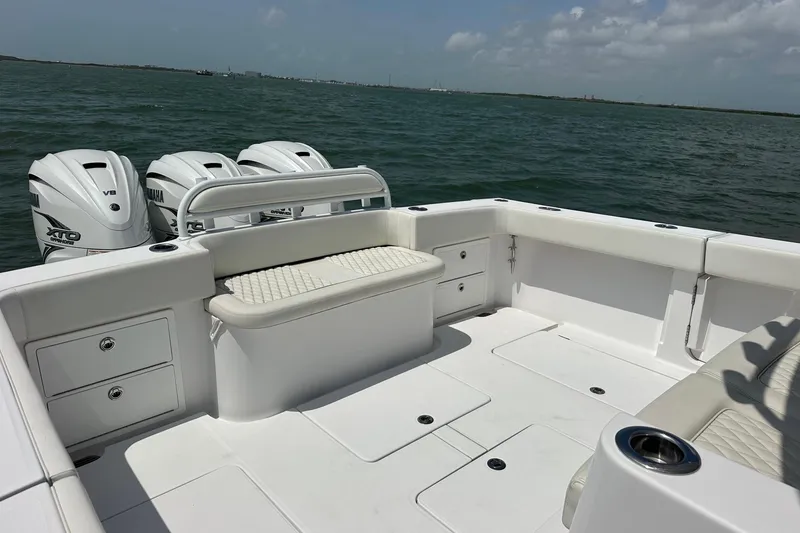 Slide: The Image of 2023 Jupiter 43 boat with Yamaha V8 engines on open water. - 14
