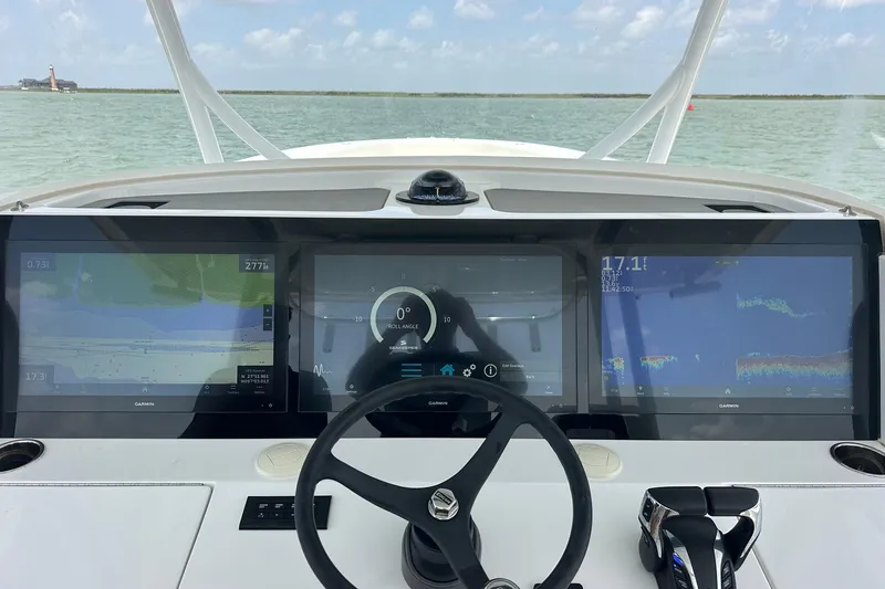 Slide: The Image of Cockpit view of 2023 Jupiter 43 boat with advanced navigation displays. - 8