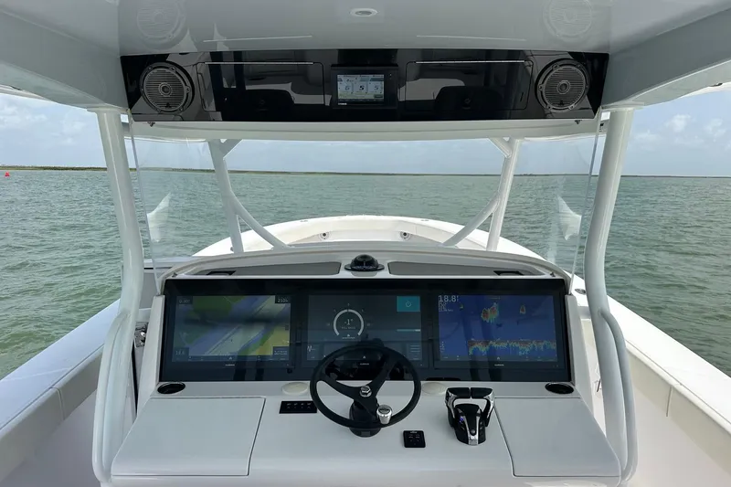 Slide: The Image of Cockpit view of 2023 Jupiter 43 boat with advanced navigation displays. - 7