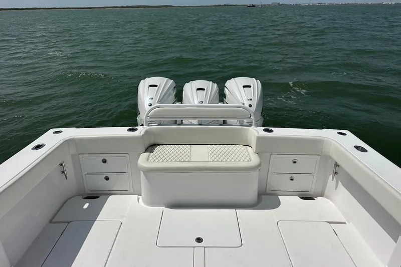 Slide: The Image of 2023 Jupiter 43 boat with triple V8 engines on open water. - 13