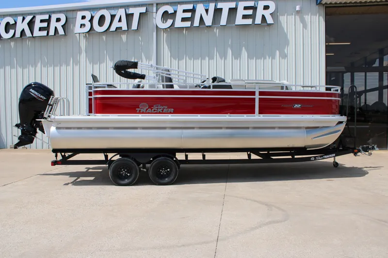 The Image of 2026 Sun Tracker Fishin' Barge 22 DLX pontoon boat at dealership. - 0