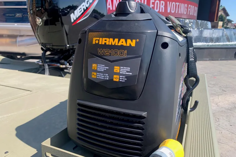 Slide: The Image of Portable Firman W2100i generator on Tracker Grizzly 2072 CC Sportsman boat, 2026 model. - 6