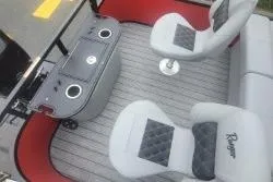 Slide: The Image of 2026 Ranger 220F boat interior with seating and console, featuring modern design and comfort. - 7