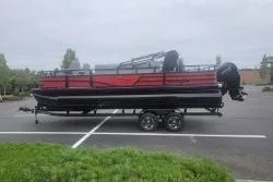 Slide: The Image of 2026 Ranger 220F pontoon boat on trailer in parking lot. - 55