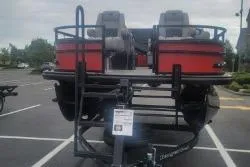 Slide: The Image of 2026 Ranger 220F boat on trailer in parking lot, rear view. - 3