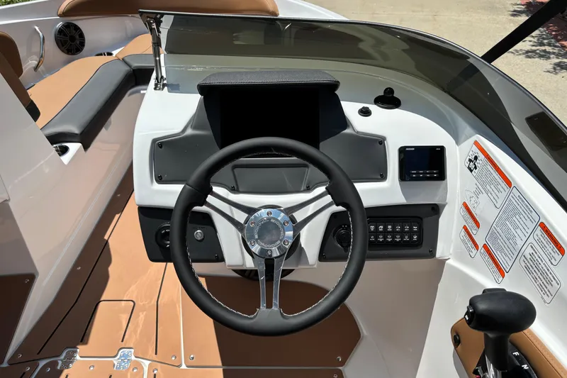 Slide: The Image of Steering console of 2026 Tahoe 210 S boat with modern controls and dashboard. - 8