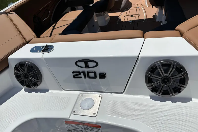 Slide: The Image of 2026 Tahoe 210 S boat interior with speakers and seating. - 11
