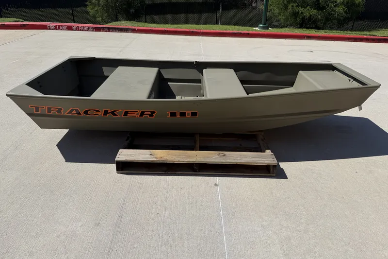 The Image of 2026 Tracker Grizzly 10 Jon boat on wooden pallet, outdoor setting. - 0