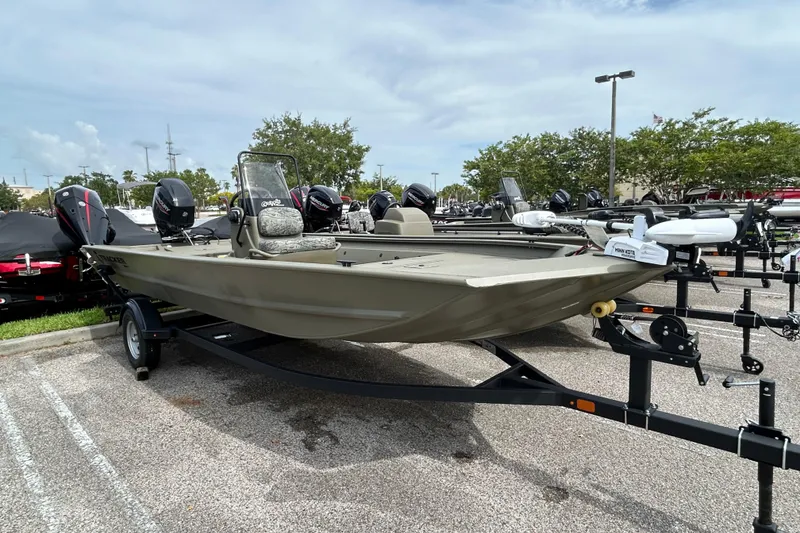 The Image of 2026 Tracker Grizzly 1860 CC boat on trailer in parking lot. - 0