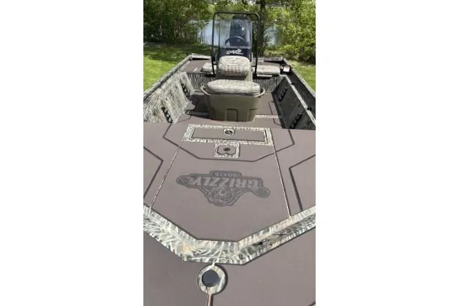 Slide: The Image of 2026 Tracker Grizzly 1860 CC boat with camo seating and spacious deck. - 3