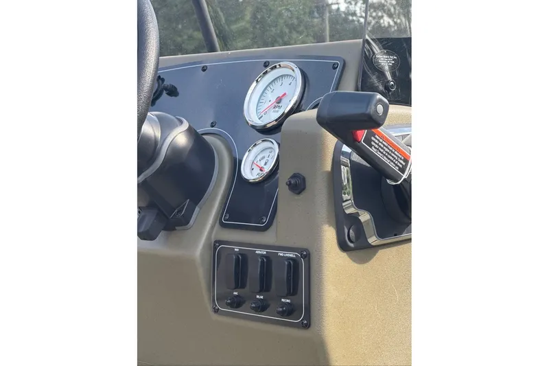 Slide: The Image of Dashboard of 2026 Tracker Grizzly 2072 CC boat with gauges and controls. - 8