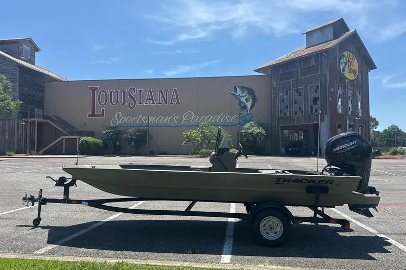 Slide: The Image of 2026 Tracker Grizzly 1860 CC boat parked at Louisiana Sportsman's Paradise. - 2