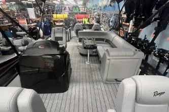 Slide: The Image of 2026 Ranger 220F boat interior with gray seating and modern design in showroom. - 5