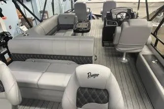 Slide: The Image of 2026 Ranger 220F boat interior with gray seating and steering console. - 7