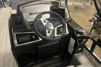 Slide: The Image of 2026 Ranger 220F boat dashboard with steering wheel and control panel. - 6