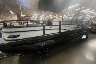 The Image of 2026 Ranger 220F pontoon boat displayed indoors, showcasing sleek design and modern features. - 0