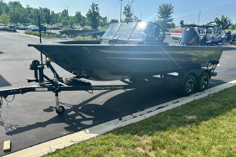 Slide: The Image of 2026 Ranger VX1988 WT boat on trailer in parking lot, sunny day. - 8