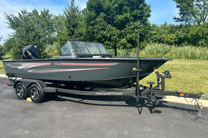 The Image of 2026 Ranger VX1988 WT boat on trailer, parked outdoors on sunny day. - 0