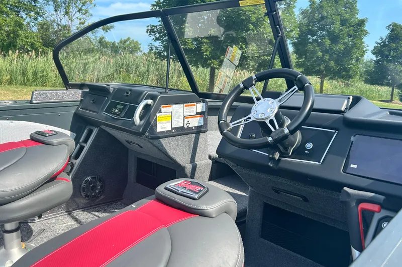 Slide: The Image of Interior of 2026 Ranger VX1988 WT boat with steering wheel and seats. - 5