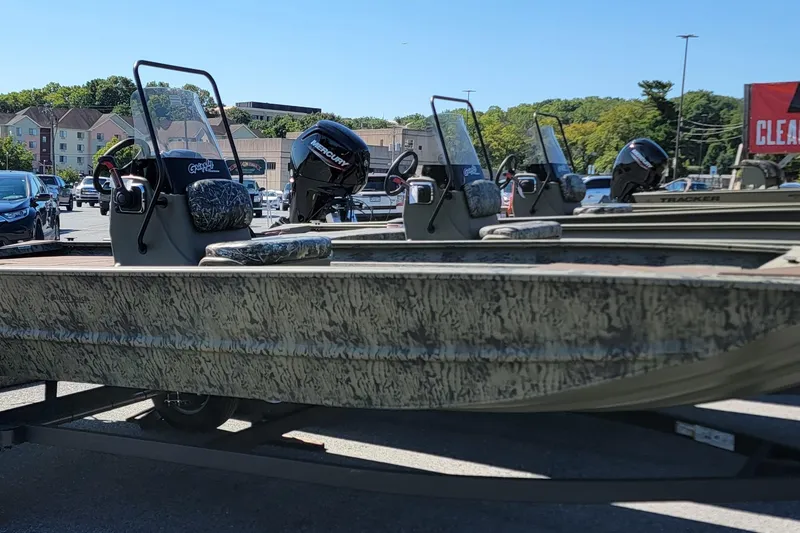 The Image of 2026 Tracker Grizzly 1860 CC boats displayed in a parking lot. - 0