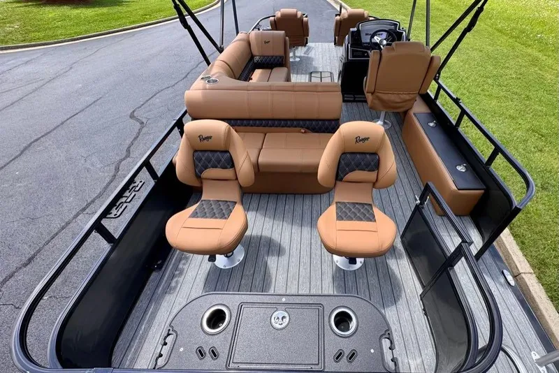 Slide: The Image of 2026 Ranger 223F boat interior with tan seating and modern design. - 12