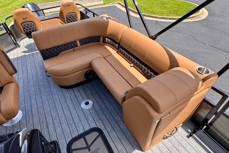 Slide: The Image of Luxurious seating on 2026 Ranger 223F boat with tan upholstery and cup holders. - 16